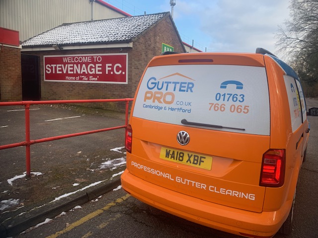 Gutter Cleaning Stevenage van parked outside football ground